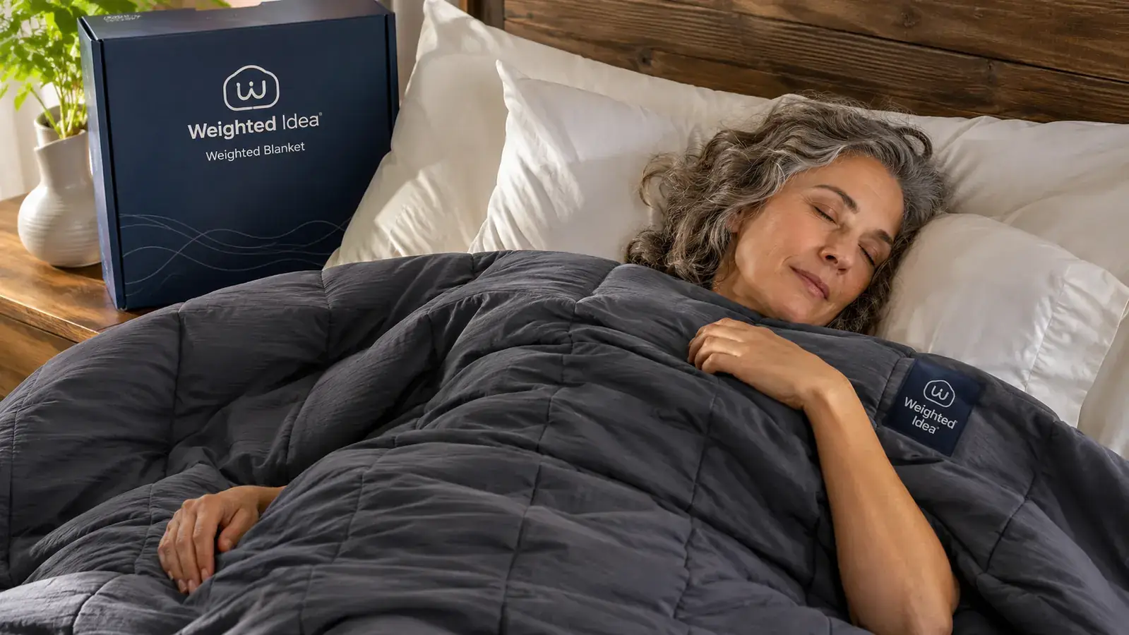 Close-up of breathable cotton weighted blanket fabric showing the quilted squares and visible stitching